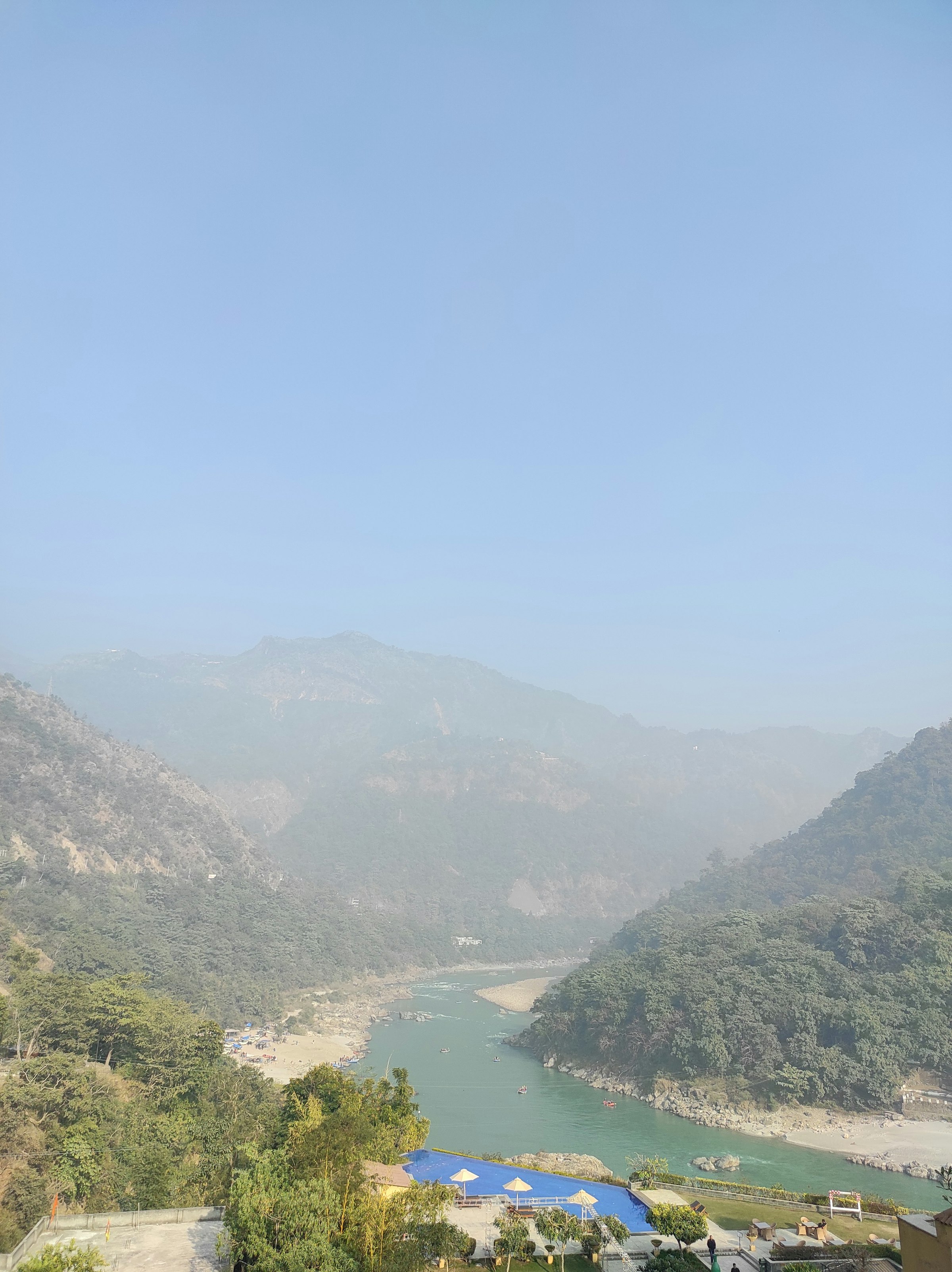 The river and mountains seen from a forested hilltop