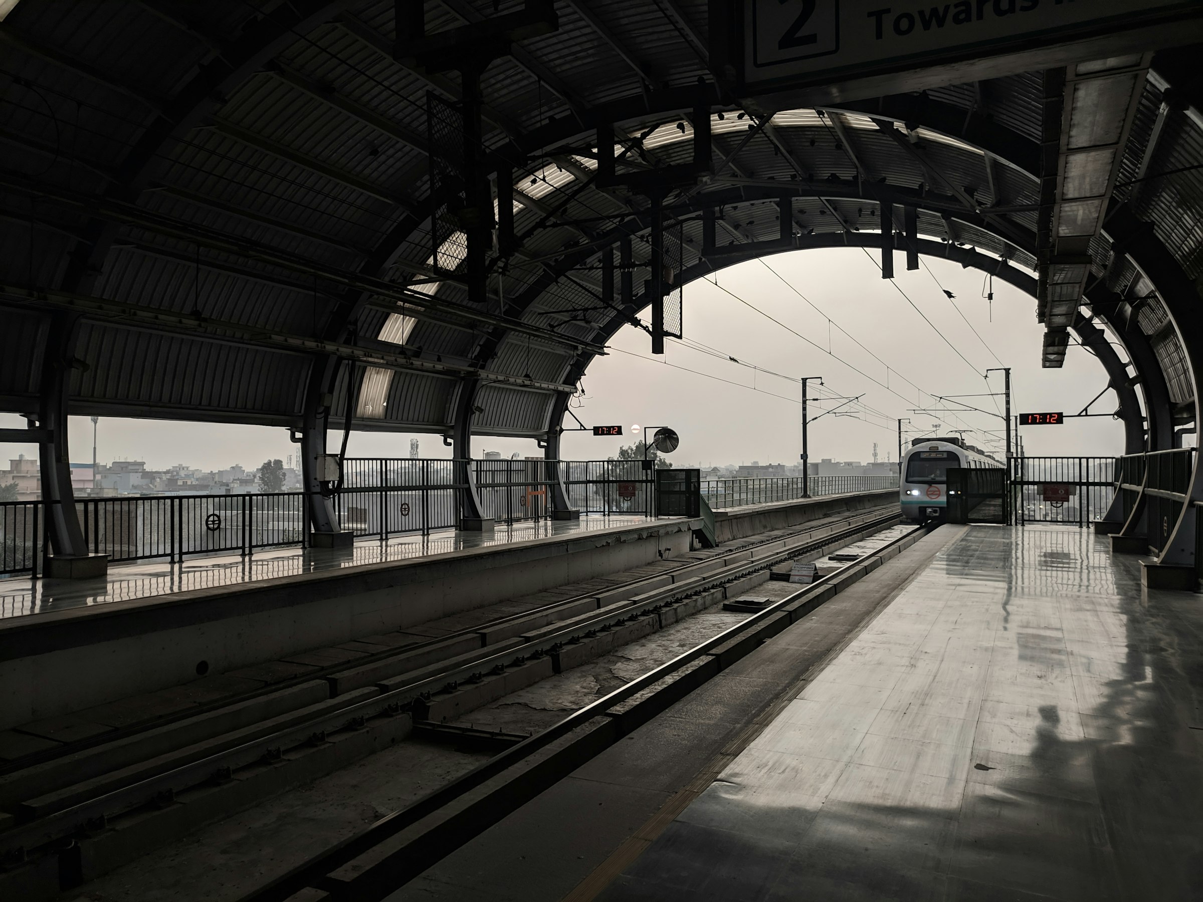 A Delhi Metro train on an elevated track