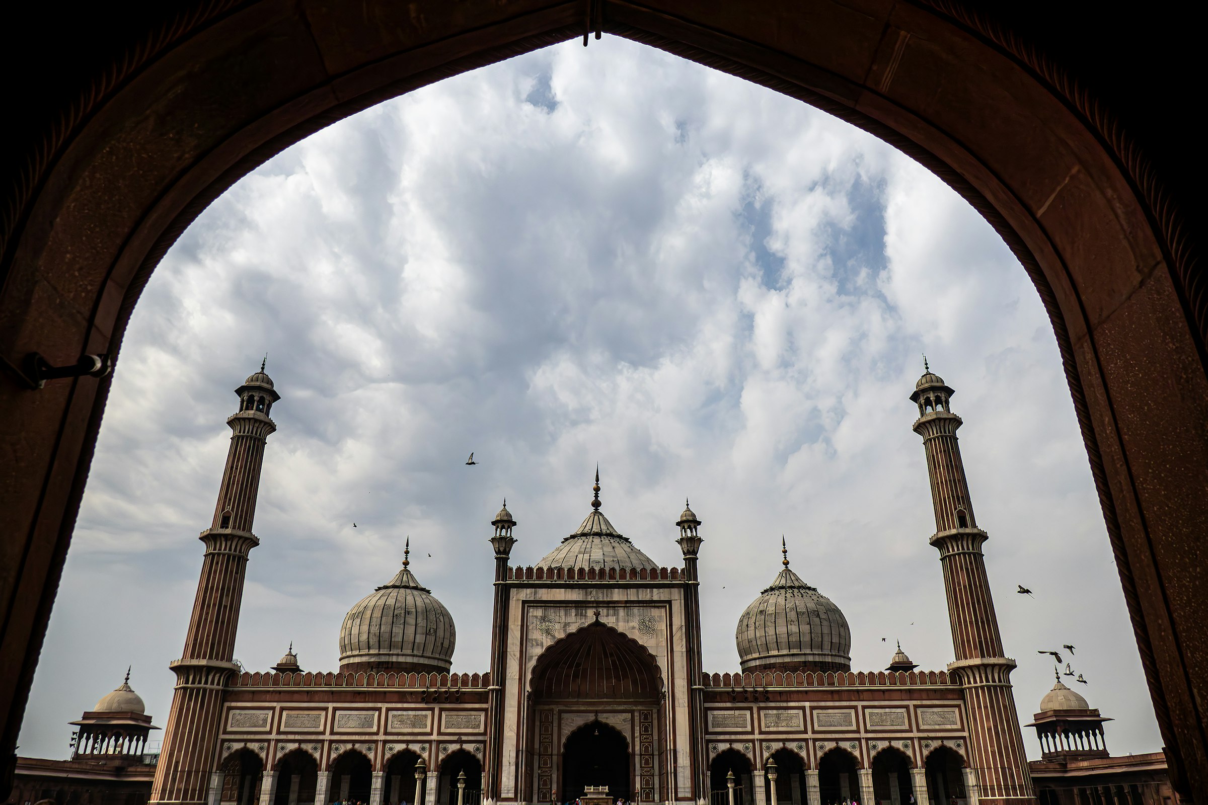 Jama Masjid seen through a stone archway