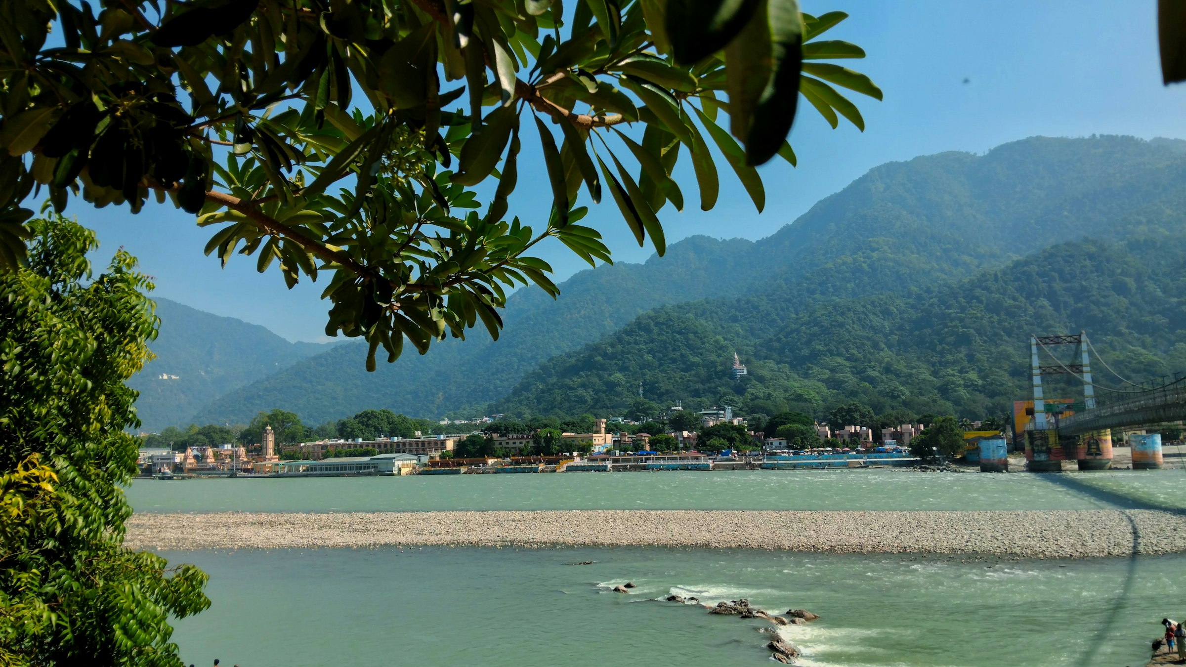 The Ganga flowing between forested hills