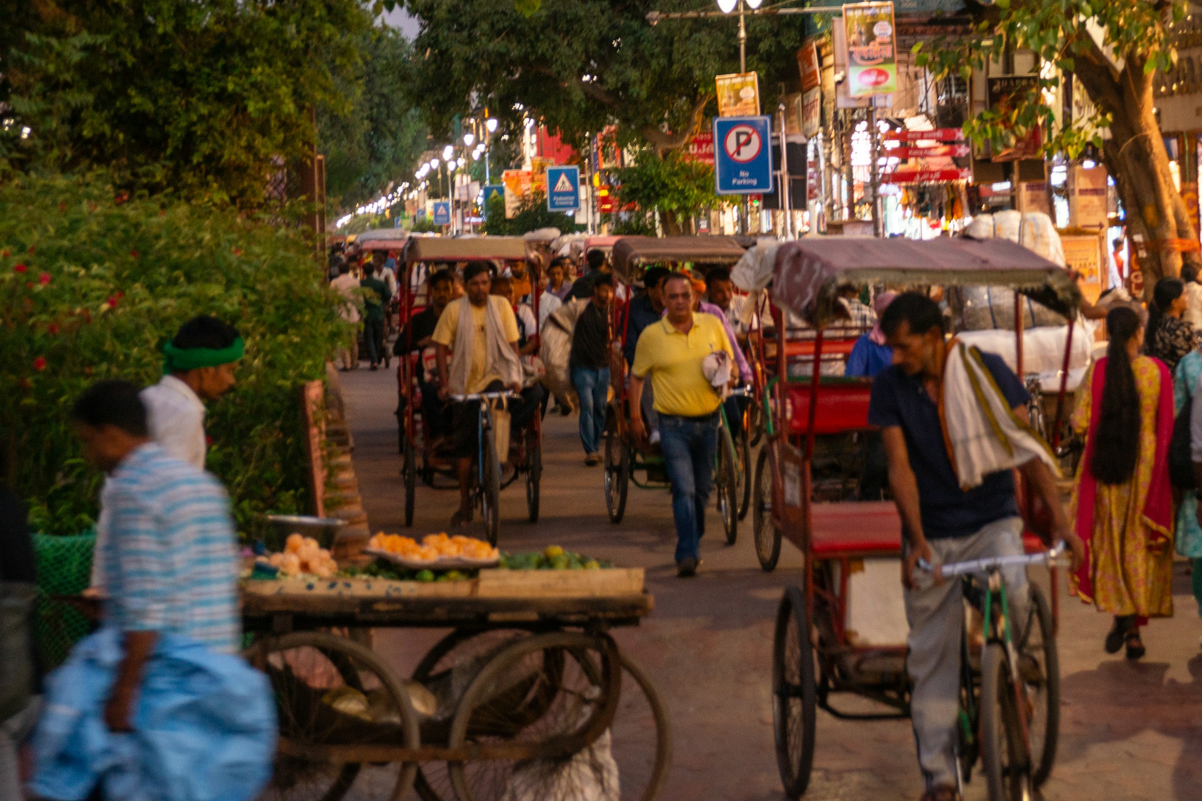 Bicycles, rickshaws and people on a Chandni Chowk street